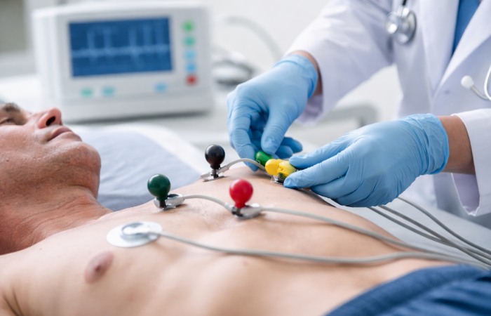 Patient undergoing ECG test as part of preventive whole body health screening