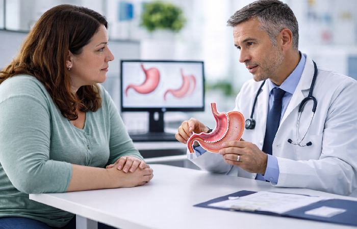 Doctor explaining gastric sleeve surgery with stomach model